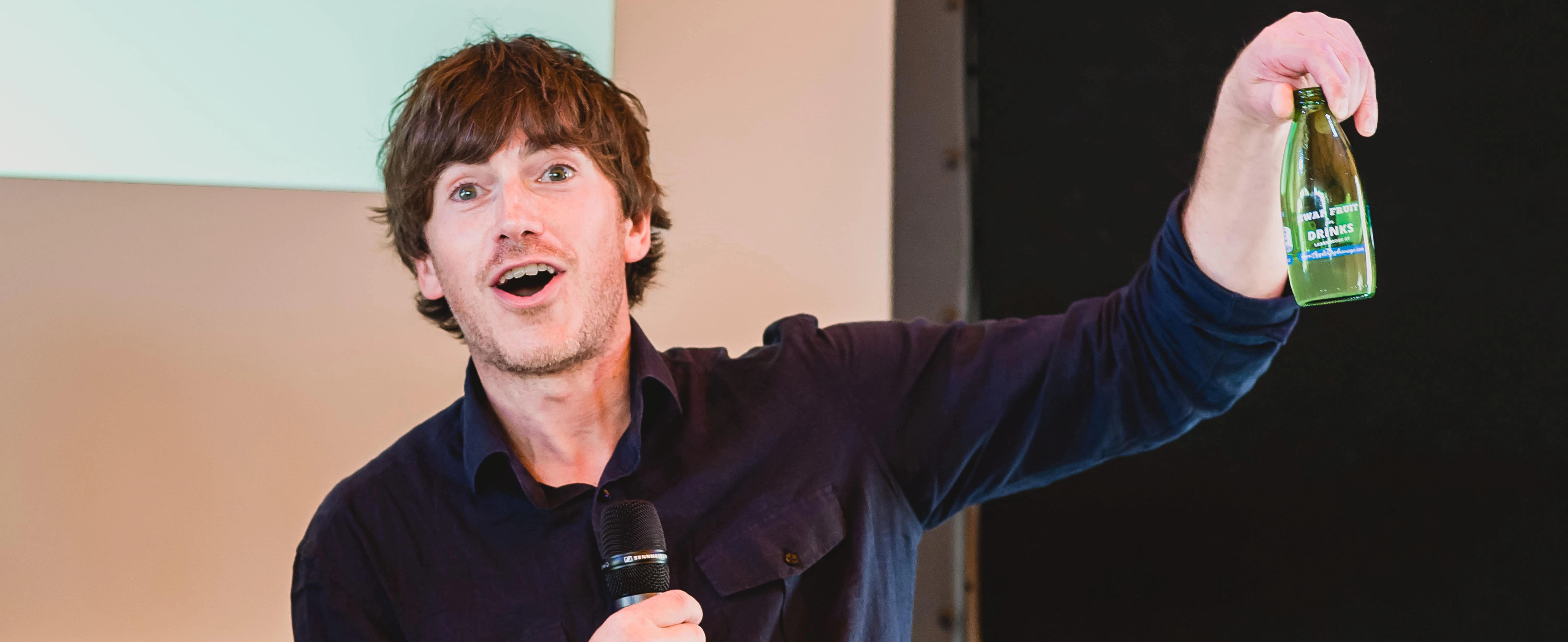 simon reeve at the podium