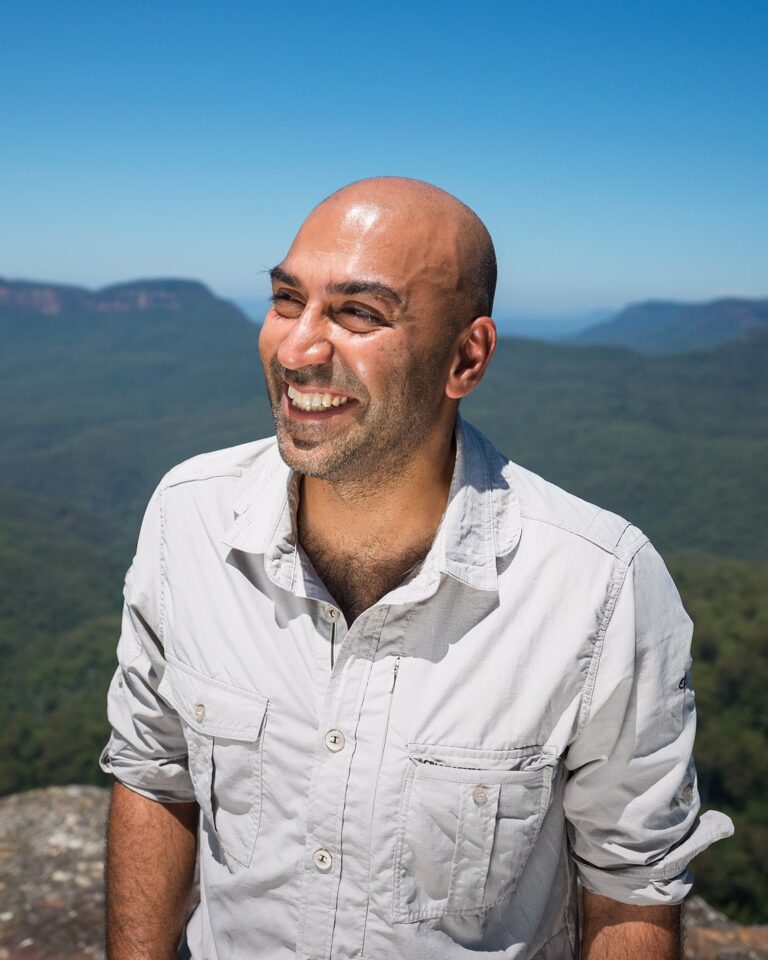 Amar Latif smiling at the camera