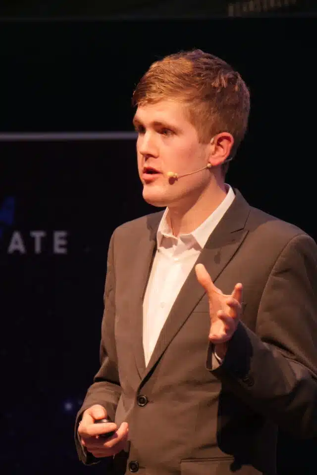 Alex Staniforth, motivational speaker looking at camera