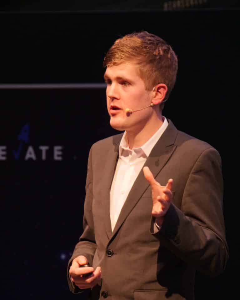 Alex Staniforth, motivational speaker looking at camera