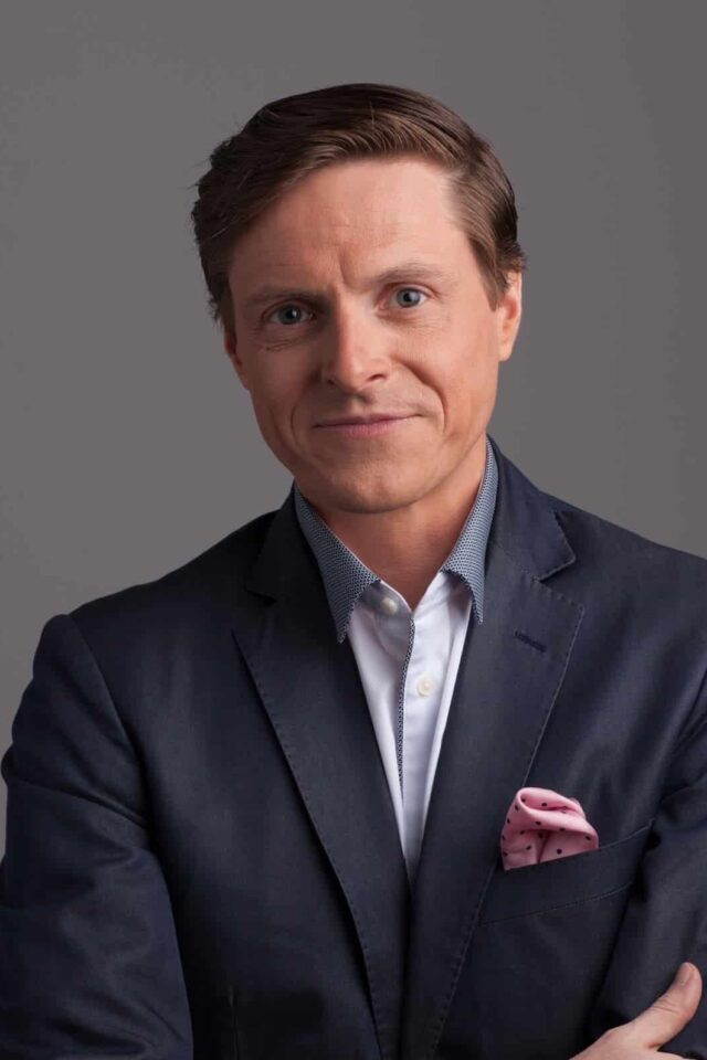 James Taylor looking at camera