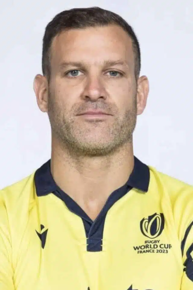 Karl Dickson with arms folded