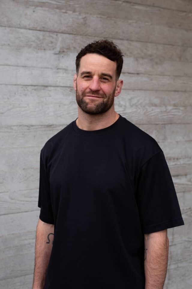 Calum Clark, sports speaker looking at camera