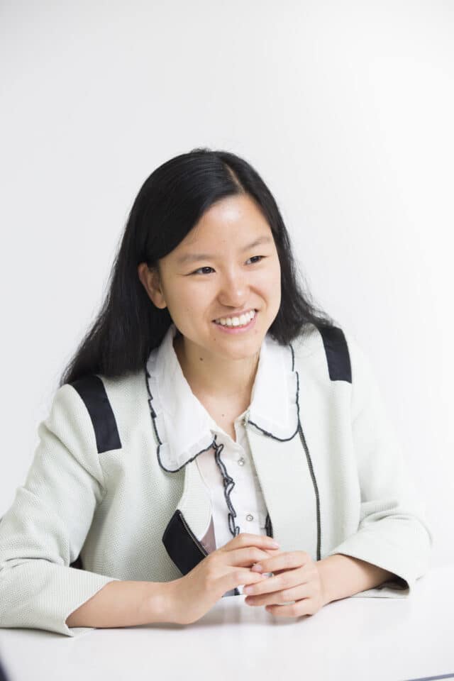 Marita Cheng, AI speaker with arms folded