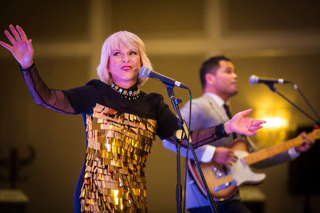 Toyah Willcox performing at a corporate event as a speaker and singer